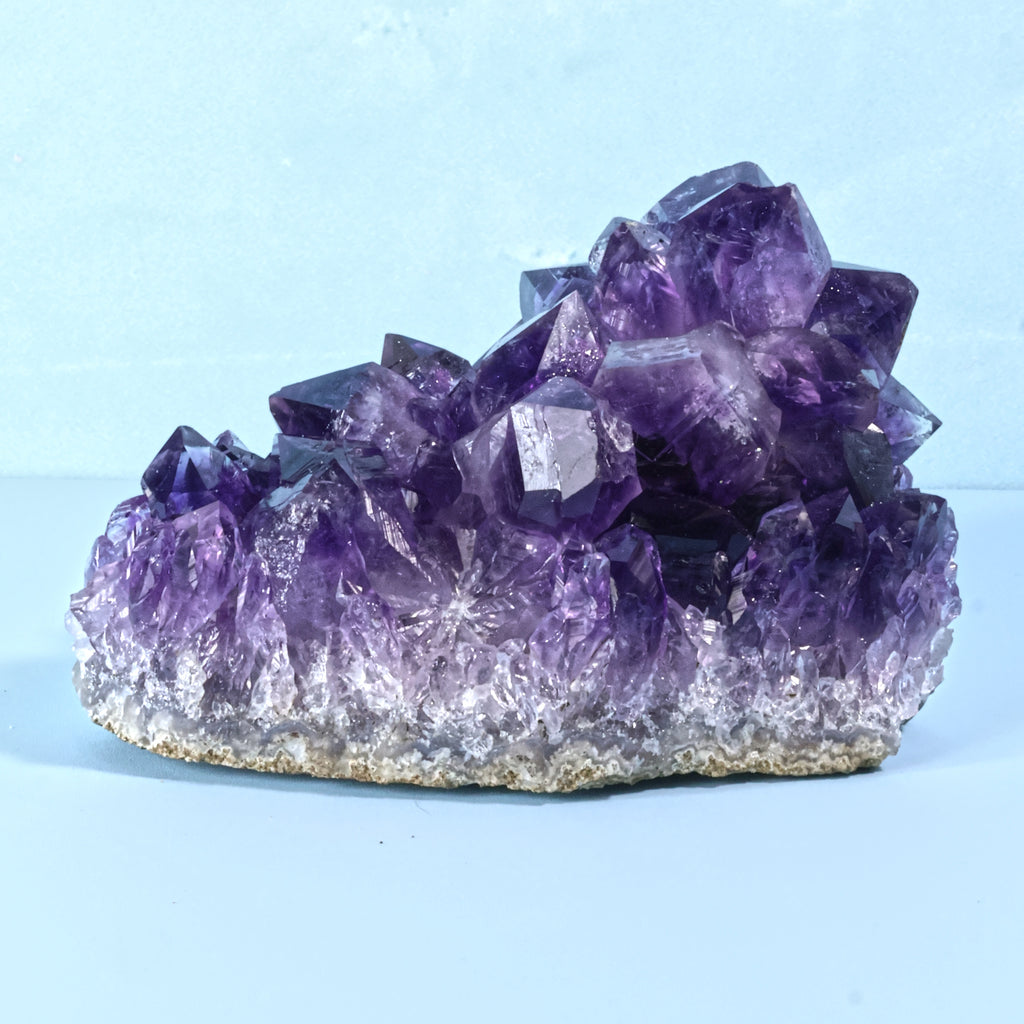 Side view of Uruguayan amethyst geode with sharp crystal points