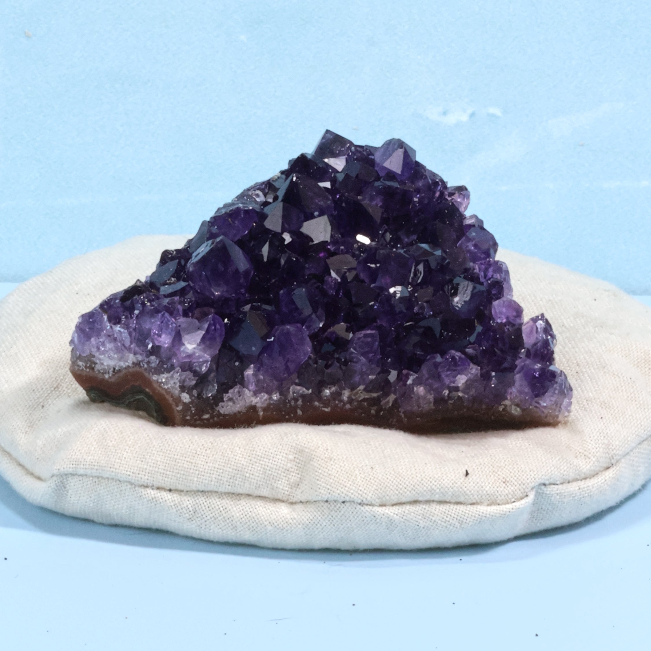 Uruguay Amethyst naturally sitting on a rock pillow