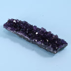 Amethyst crystal on a light blue background