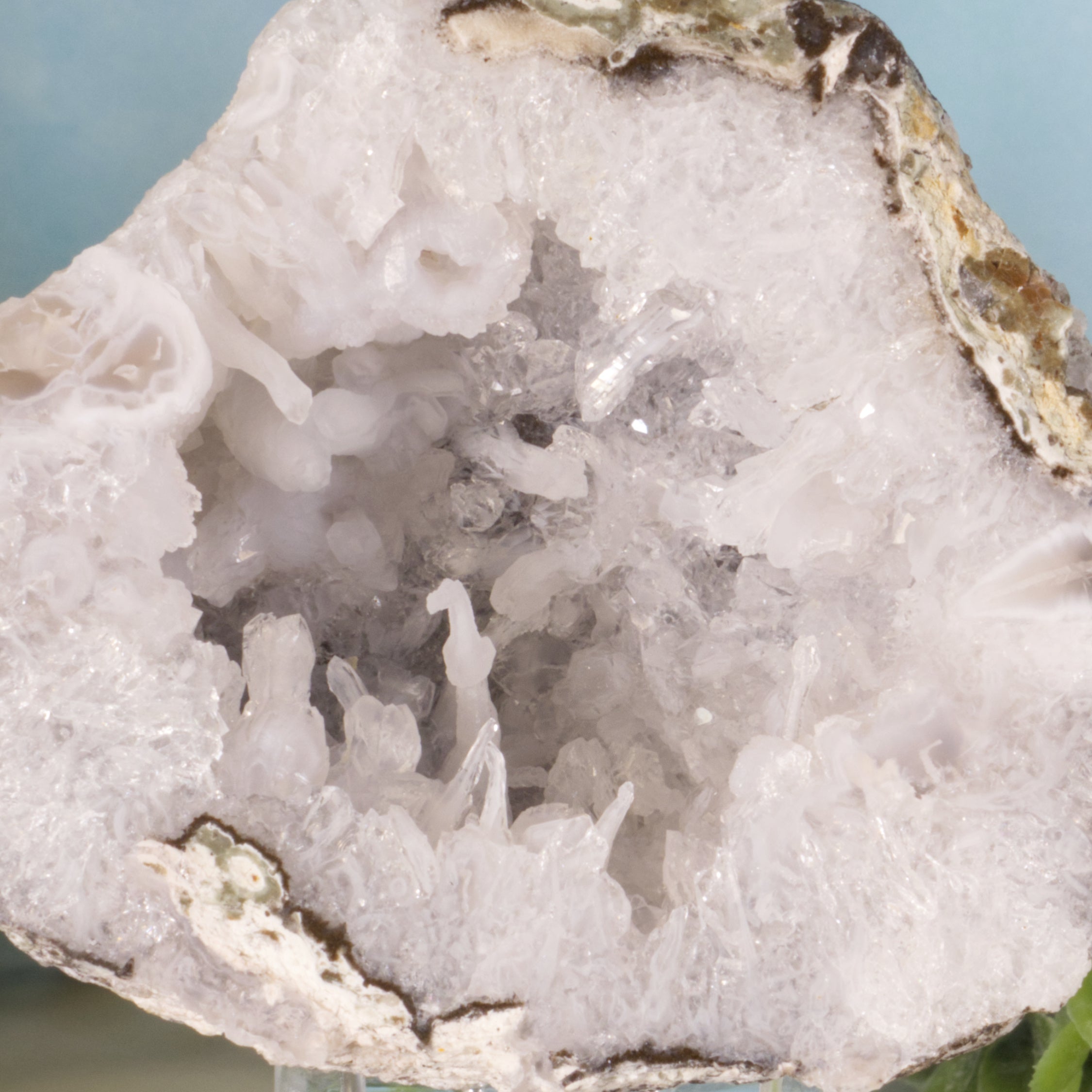 Close-up of a crystal formation with a light blue background