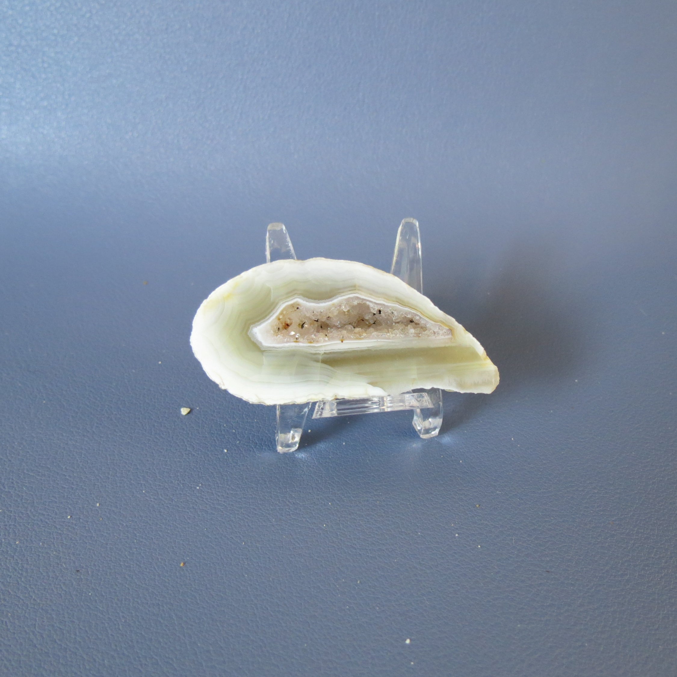 Geode on a stand against a gray background