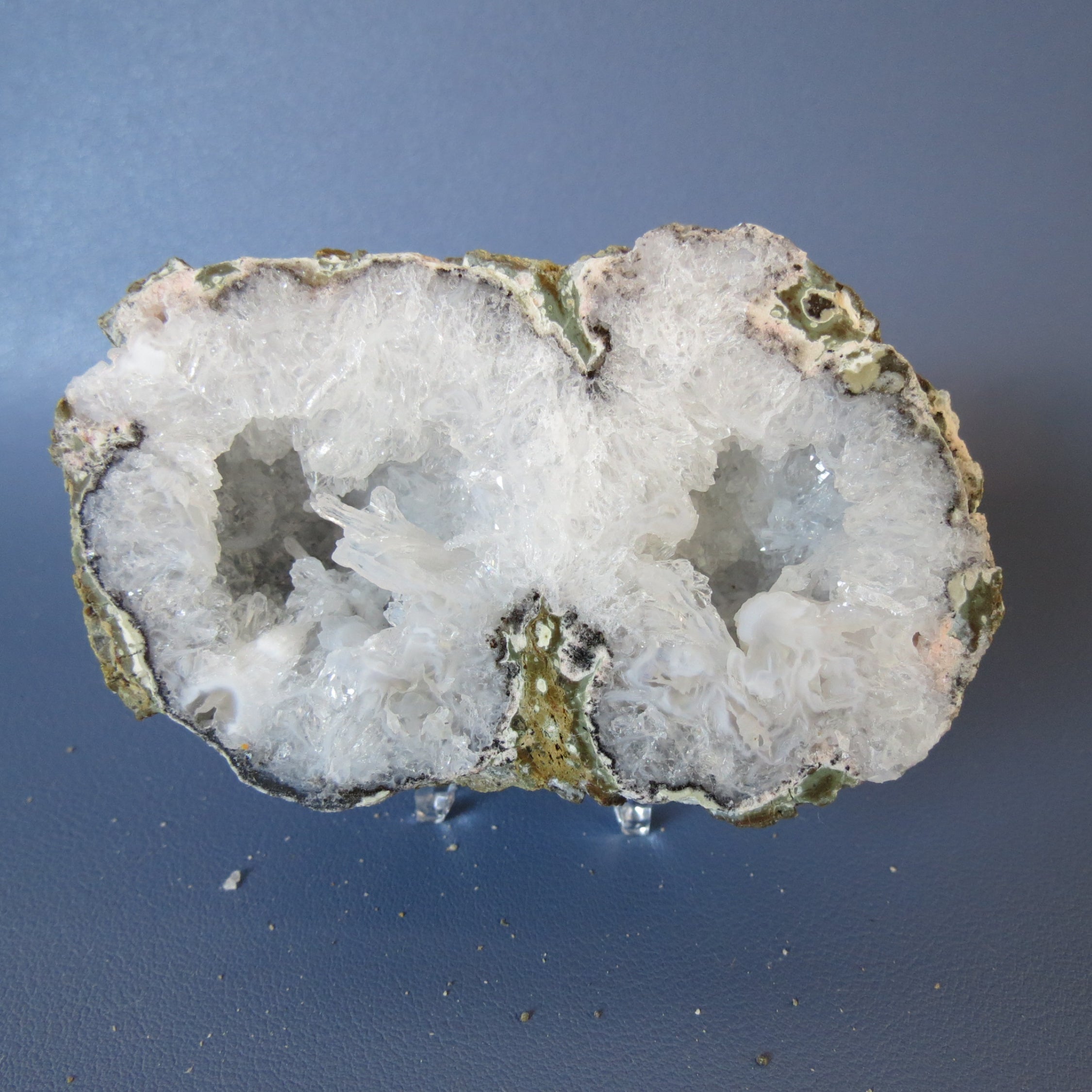 Geode with crystal formation on a blue background